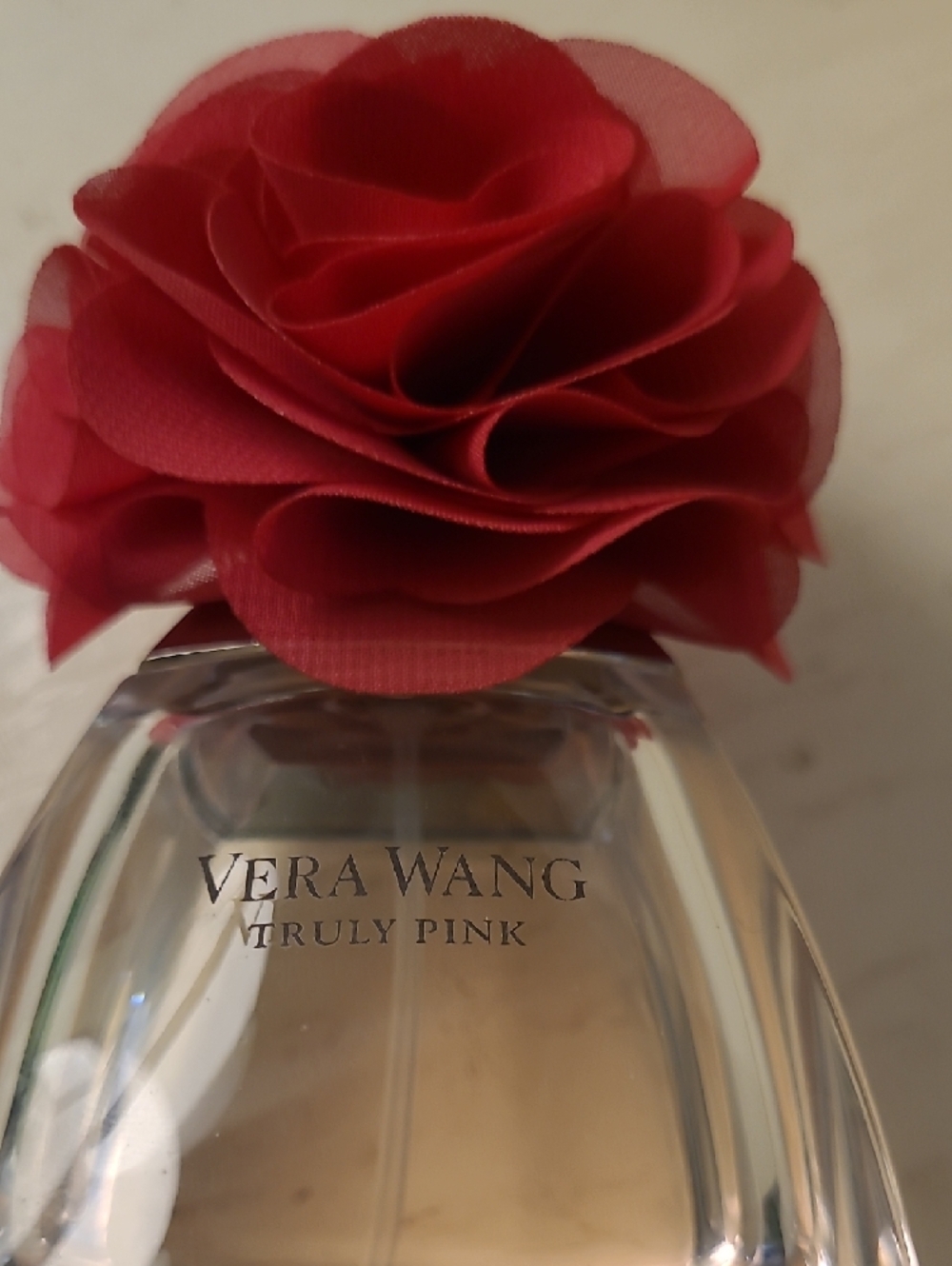 Vera Wang Fragrance bottle with bright red floral cap - Picture 2 of 3